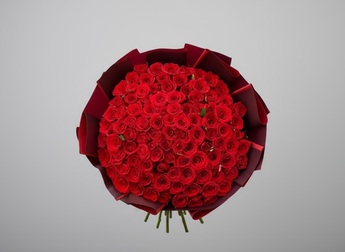 Bouquet of red roses wrapped in red paper