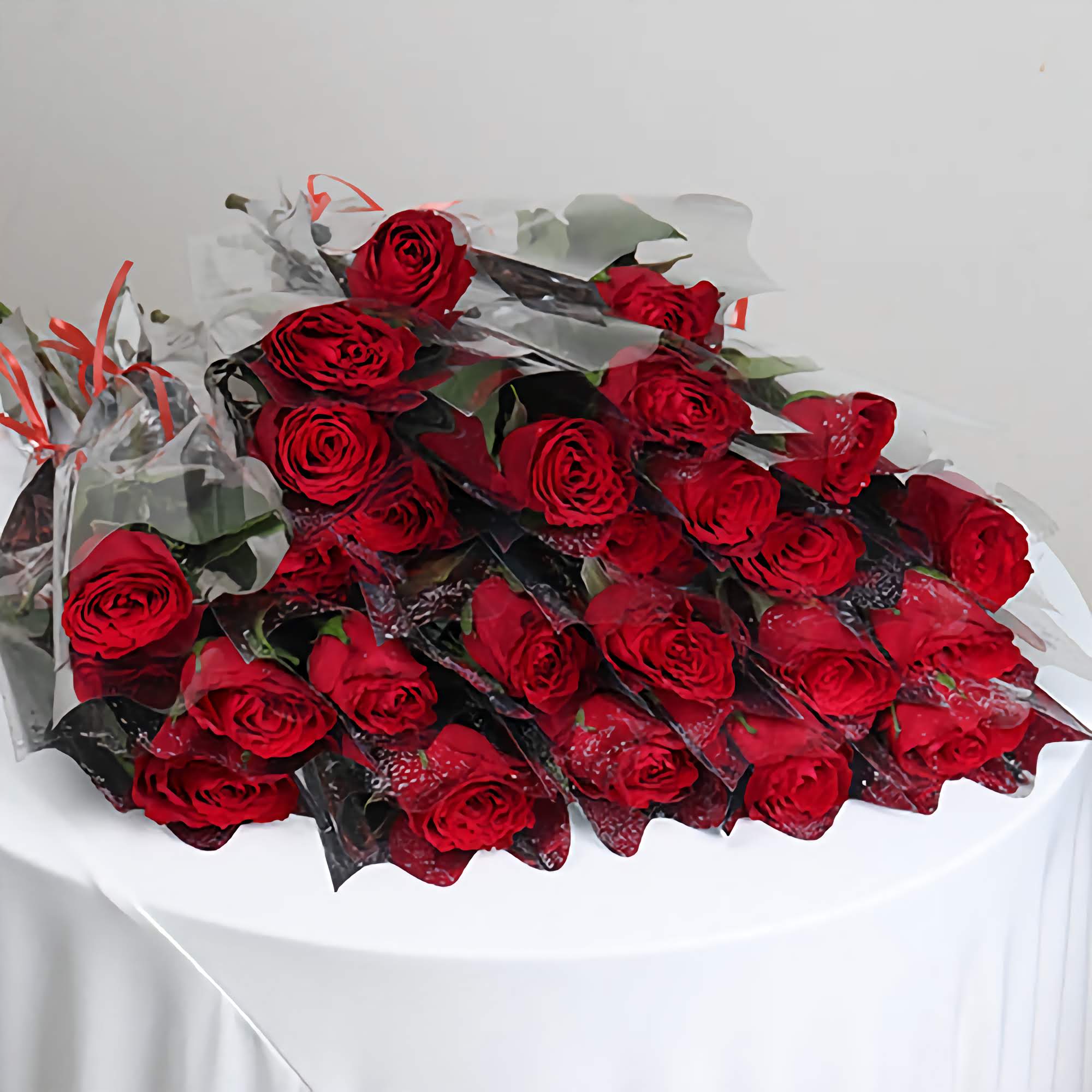 Bouquet of fresh Single Red Rose flowers arranged elegantly on a table