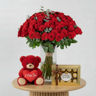 Bouquet of red roses in a clear vase on a white background