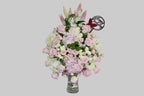 Bouquet of flowers in a vase on a gray background