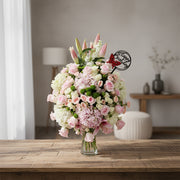 Bouquet of flowers in a vase on a gray background