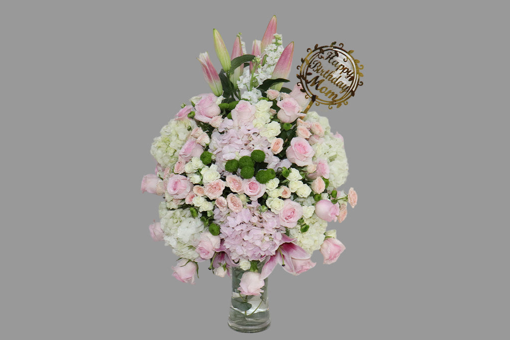 Bouquet of flowers with a 'Happy Birthday Mom'