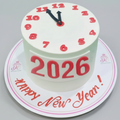 Cake with a clock face and '2026 Happy New Year!' text on a red background