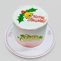 Christmas-themed cake with 'Merry Christmas' text and decorations on a white background