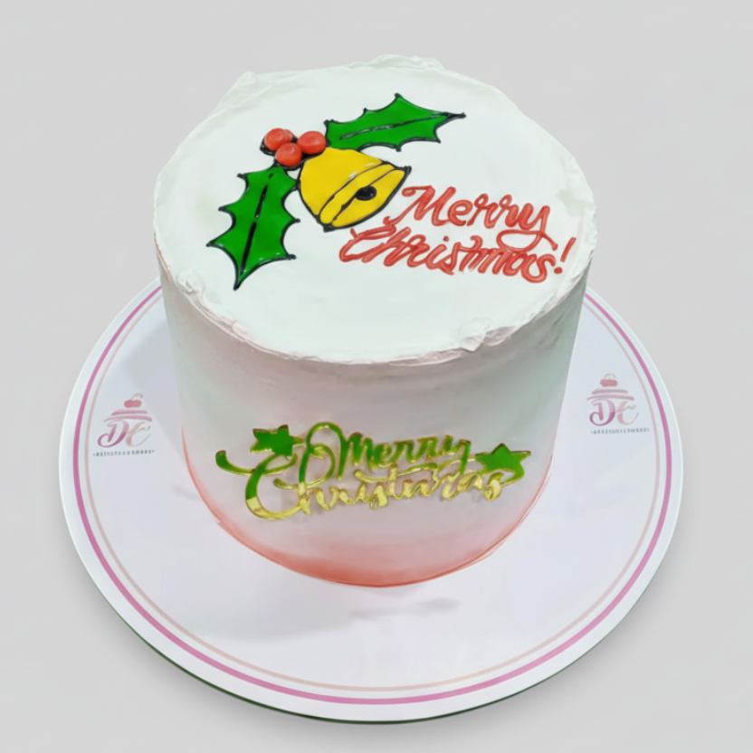 Christmas-themed cake with 'Merry Christmas' text and decorations on a white background