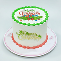 Christmas-themed cake with decorative icing on a white background