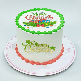 Christmas-themed cake with decorative icing on a white background