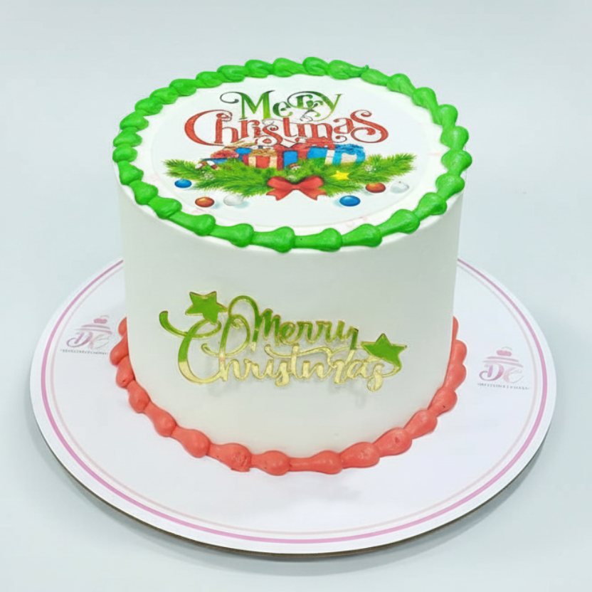 Christmas-themed cake with decorative icing on a white background