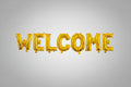 Gold 'WELCOME' balloon letters