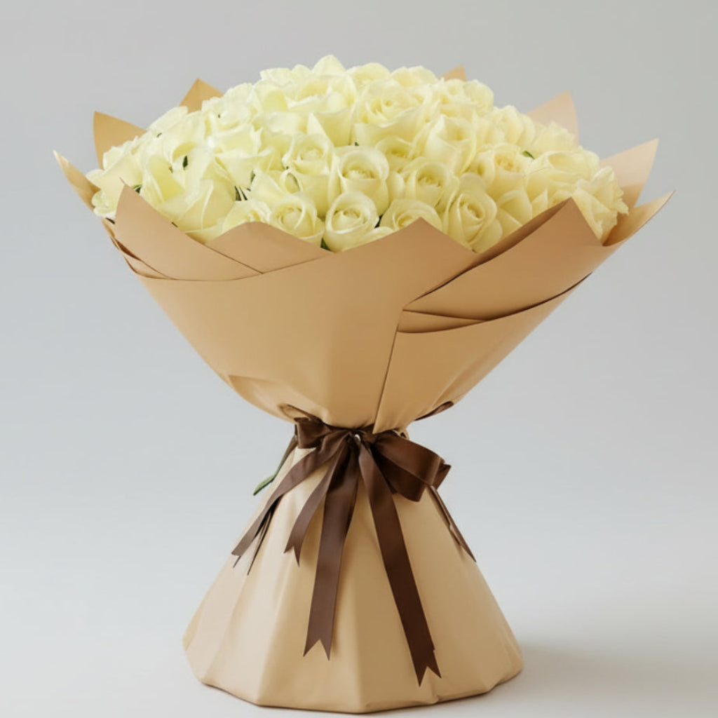 Grand bouquet of 100 white roses wrapped in elegant kraft paper with brown ribbon - luxury flower arrangement Kuwait