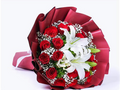Hand bouquet 20 red roses 1 lily and gypsum
