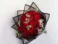Red rose hand bouquet with white vex