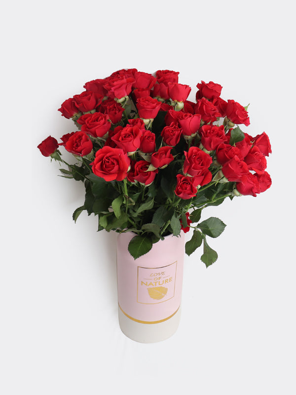 pink vase red baby roses — same-day flower delivery in Kuwait