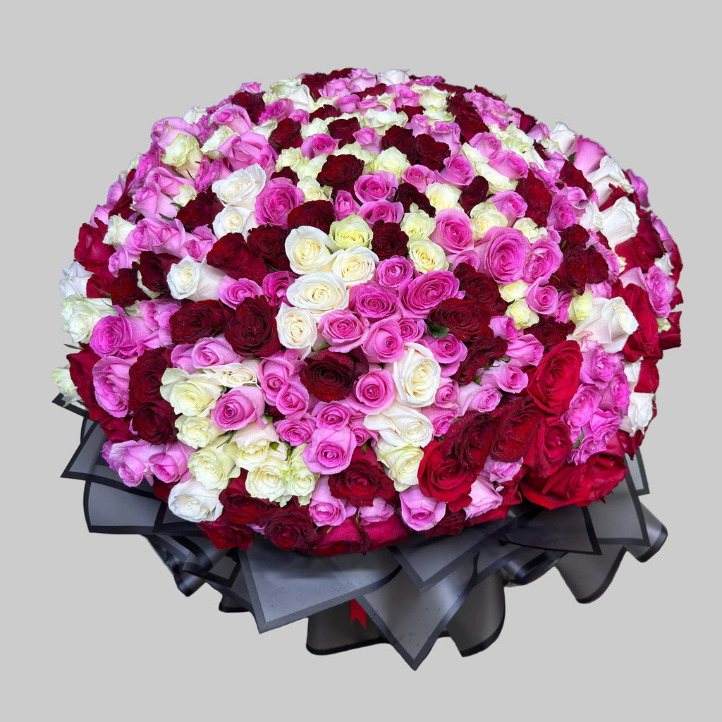 Large bouquet of red, pink, and white flowers