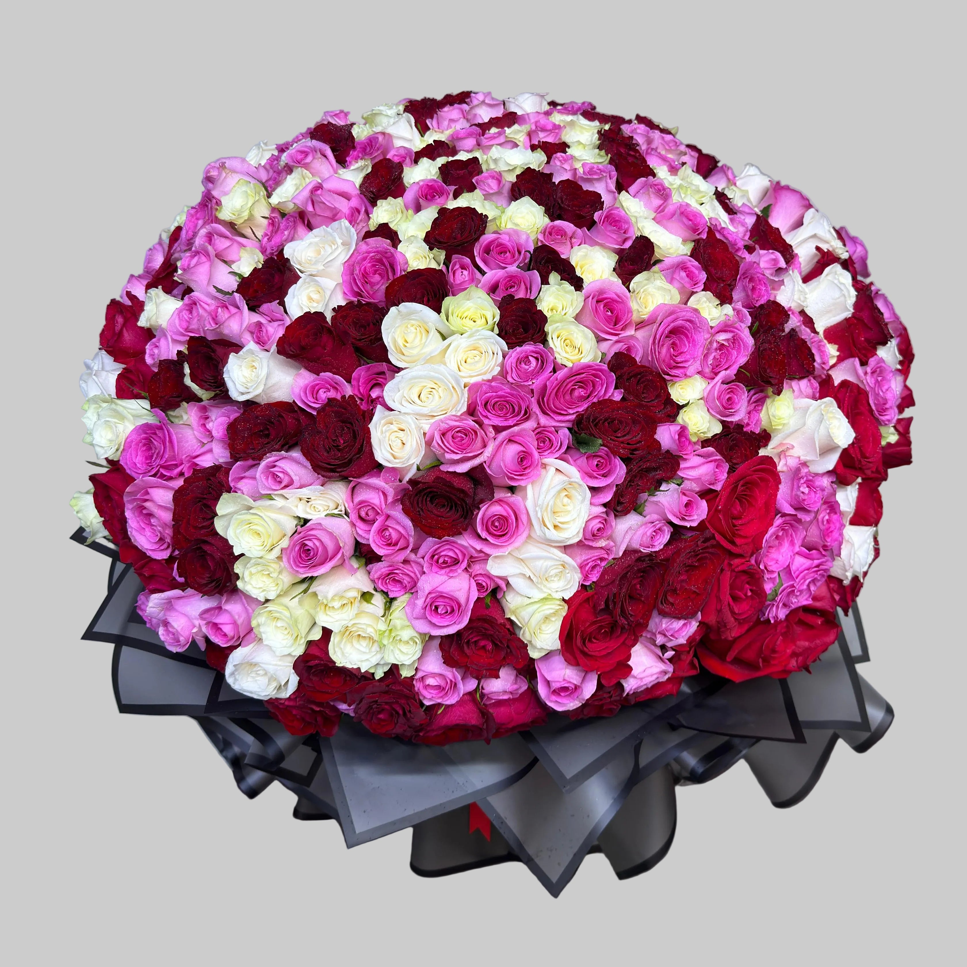 Large bouquet of red, pink, and white flowers