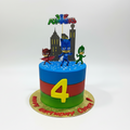 PJ Masks birthday cake with characters and colorful design on a white background