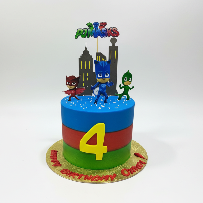 PJ Masks birthday cake with characters and colorful design on a white background