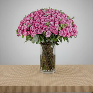 Purple Roses in Clear Vase