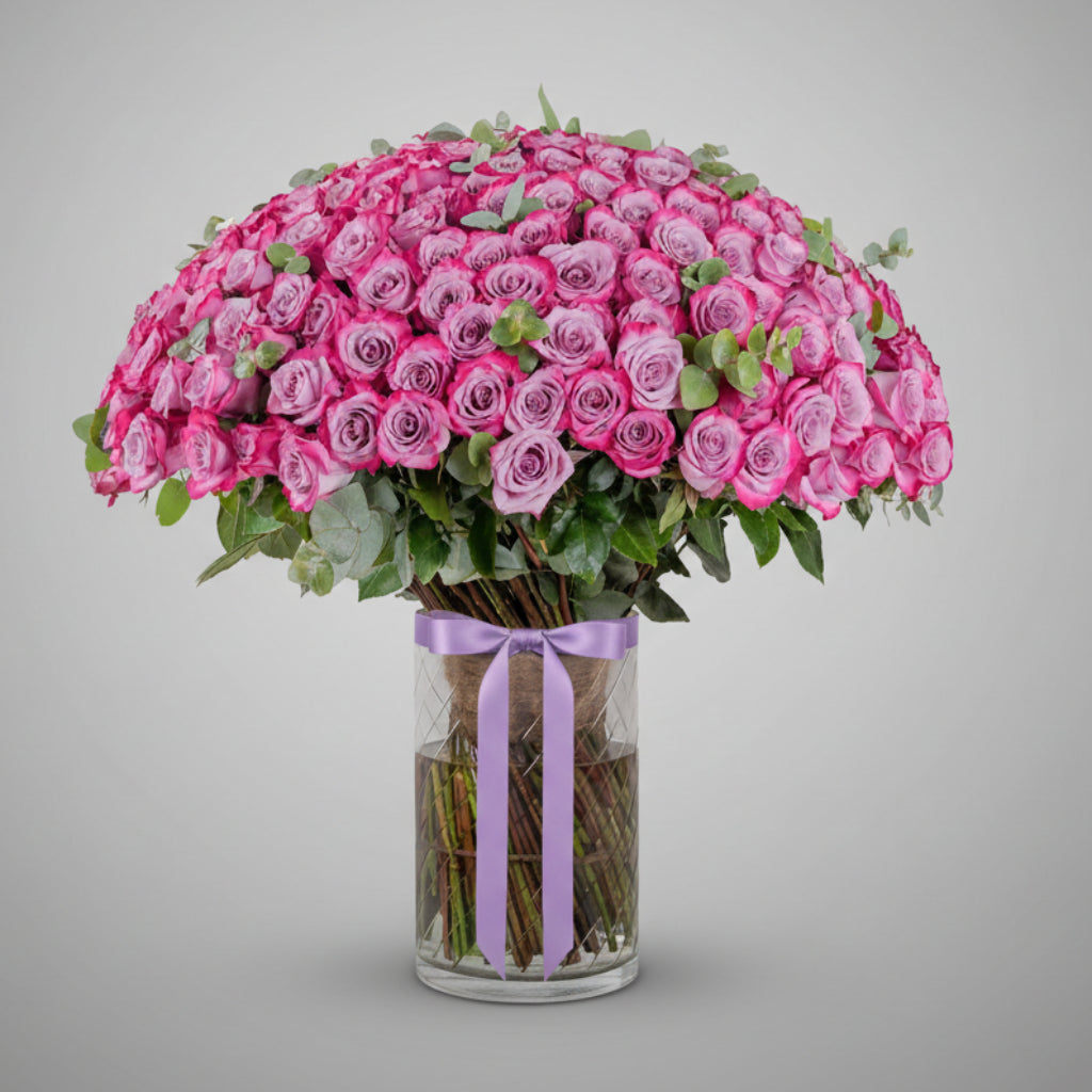 Purple Roses in Clear Vase