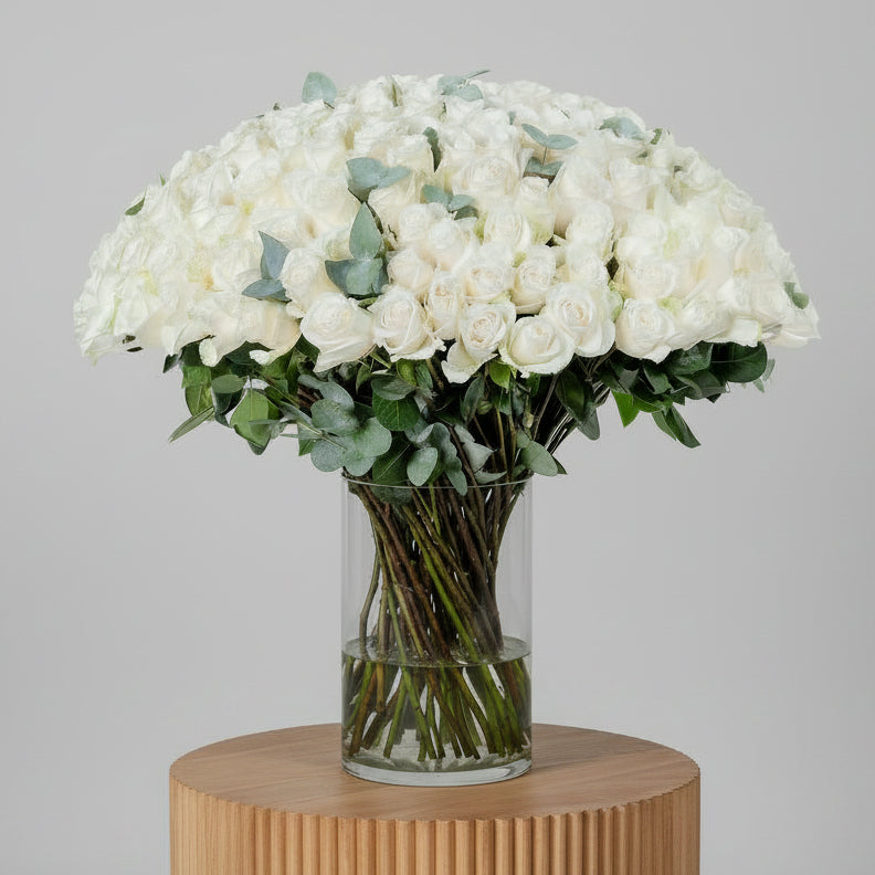 White Roses in Glass Vase