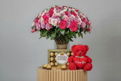 blush roses in clear vase