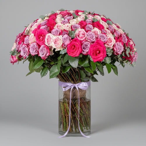 blush roses in clear vase