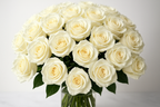 Bouquet of white roses in a clear vase on a light background