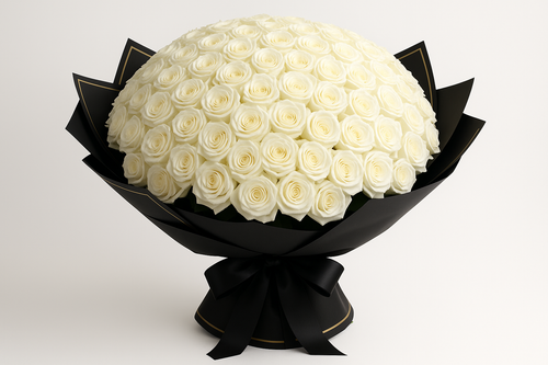 Bouquet of white roses wrapped in black paper and ribbon on a light gray background