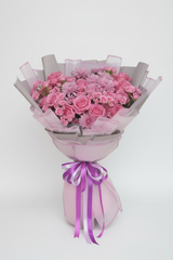 Pink Mix Flowers Bouquet – Purple Wrap, editorial white background