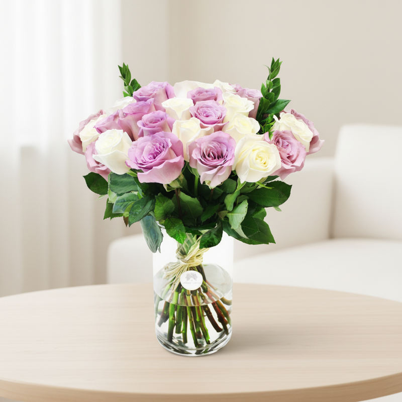 White and purple roses in a vase in an elegant neutral interior