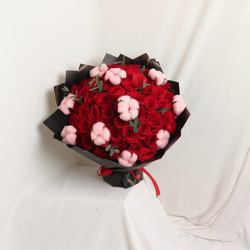 Mother Red Roses With Pink Cotton bouquet on a warm white background