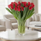 30 fresh red tulips in a vase in elegant home
