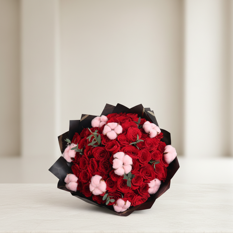 Mother Red Roses With Pink Cotton bouquet in an elegant neutral home setting