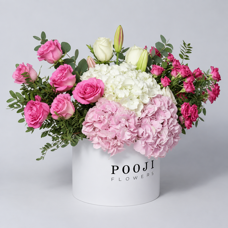 Pink Romance Luxury Flower Box shown from a 45-degree side angle with the Pooji Flowers logo and box depth visible