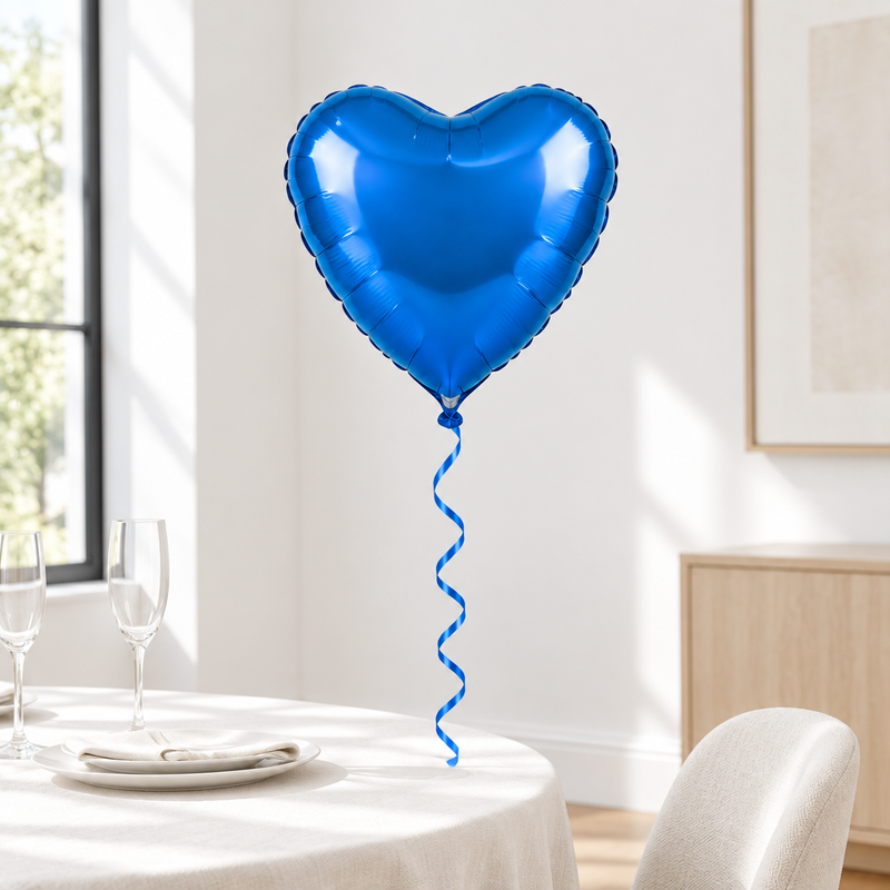Blue heart-shaped helium foil balloon in a bright celebration setting