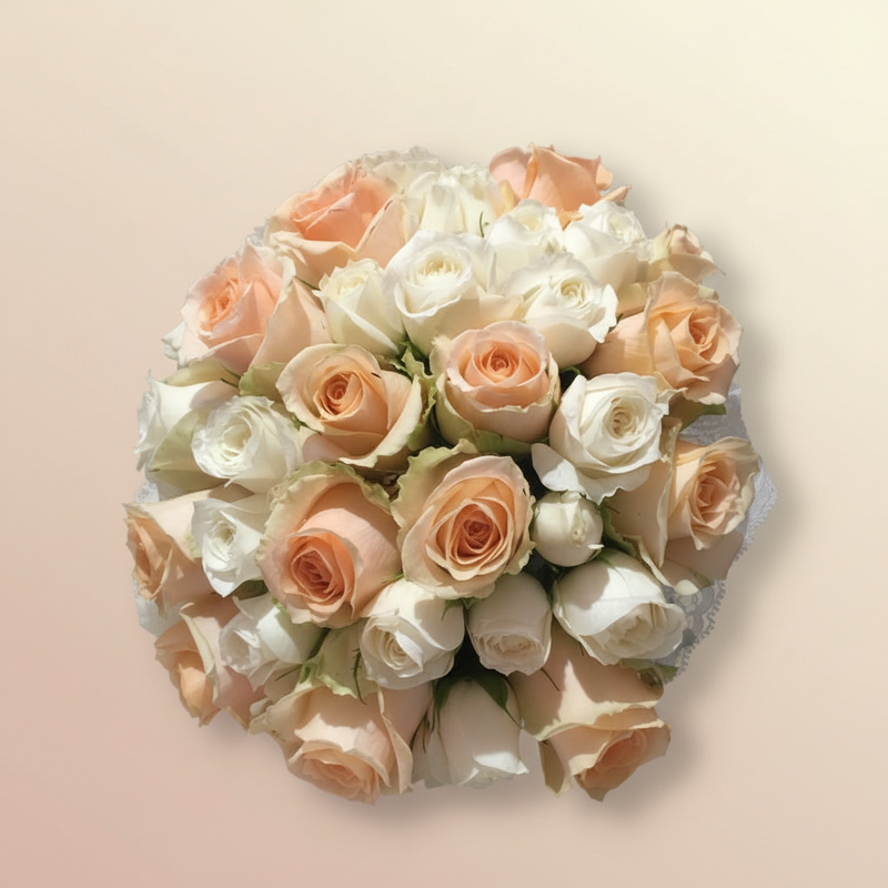Top-down view of peach and white bridal bouquet