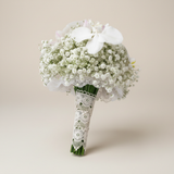 White gypsophila and Phalaenopsis orchid bridal bouquet three-quarter view