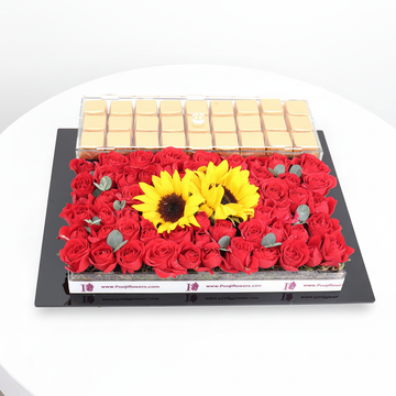 Gold chocolates tray with fresh roses and sunflowers