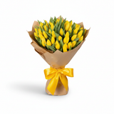 Alternate angle of yellow tulip hand bouquet