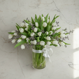 Top-down view of white tulip vase arrangement