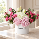 Pink Romance Luxury Flower Box with the Pooji Flowers logo shown in a bright lifestyle gifting setting