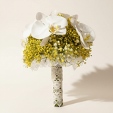 Yellow gypsophila and white Phalaenopsis orchid bridal bouquet on a warm white background