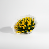 Alternate angle of 30 fresh yellow tulips bouquet
