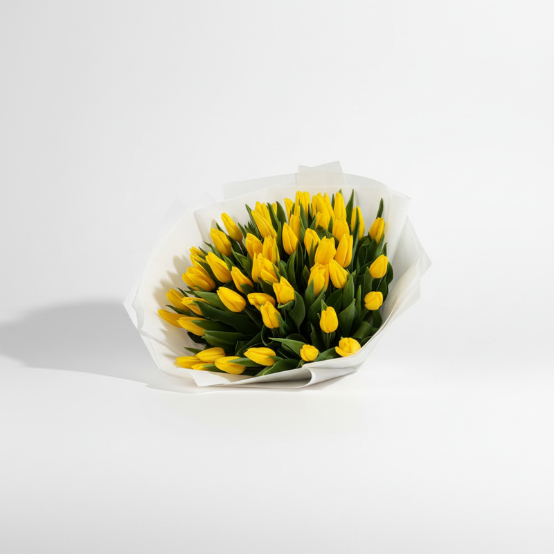 Alternate angle of 30 fresh yellow tulips bouquet