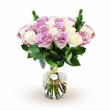 White and purple roses in a vase on a warm white background