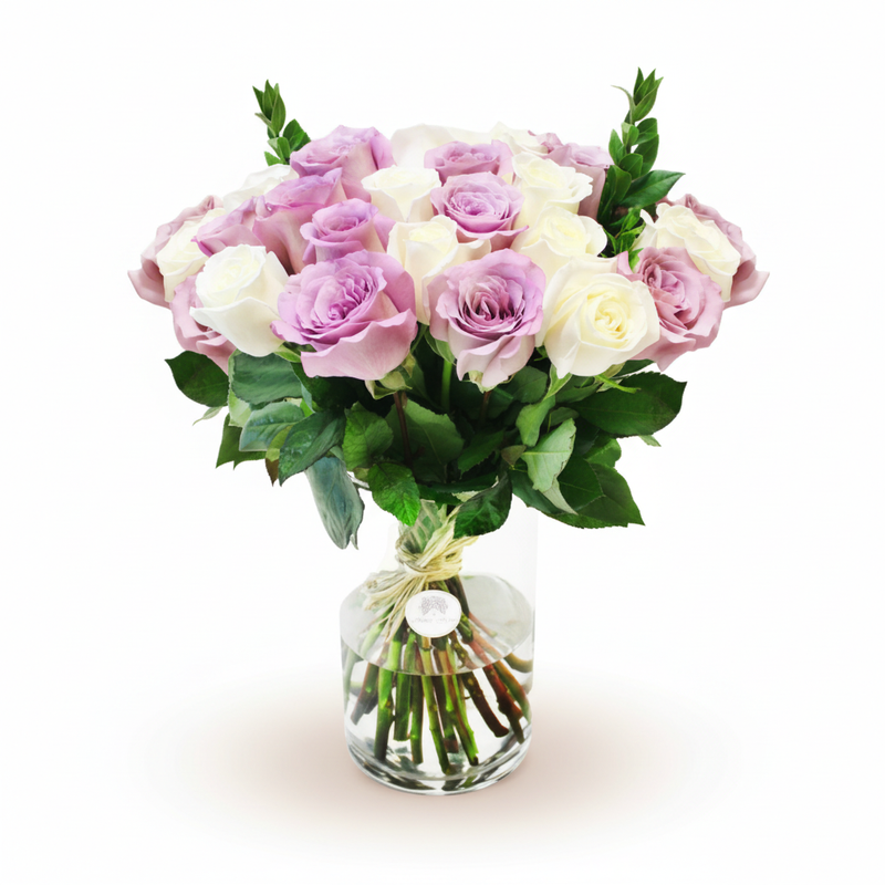 White and purple roses in a vase on a warm white background