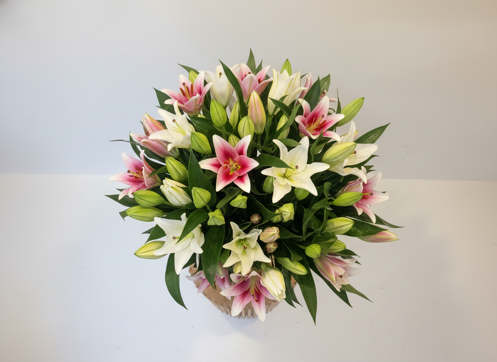 Pink and white lily bouquet overhead view