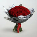 Stunning Red Roses Bouquet Chocolate beautifully arranged with lush green stems