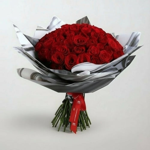 Stunning Red Roses Bouquet Chocolate beautifully arranged with lush green stems