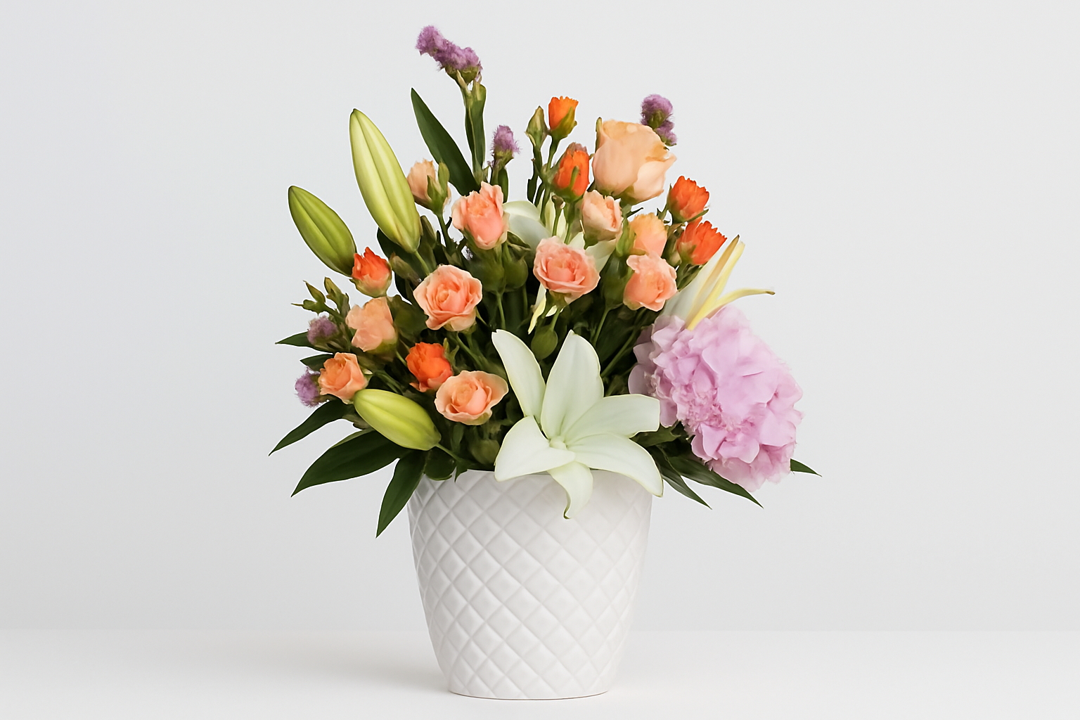 Bouquet of flowers in a white vase on a light gray background